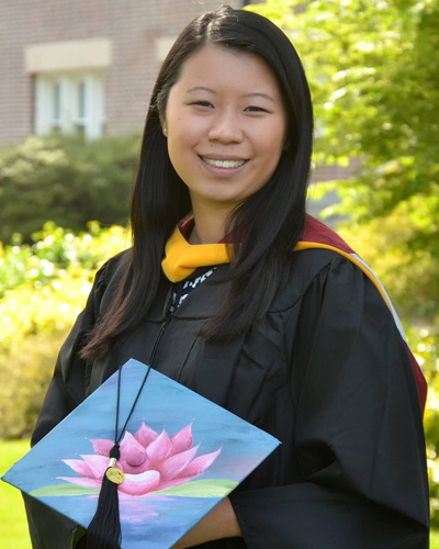 Headshot photograph of PCOM biomedical sciences graduate Julia Burns wearing her cap and gown