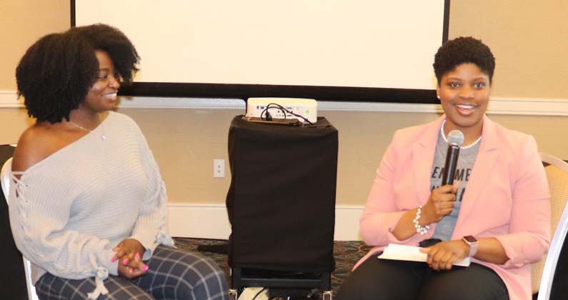 PCOM medical student Alicia Williams (DO '22) speaks into a microphone alongside her guest, Magdala Chery, DO.