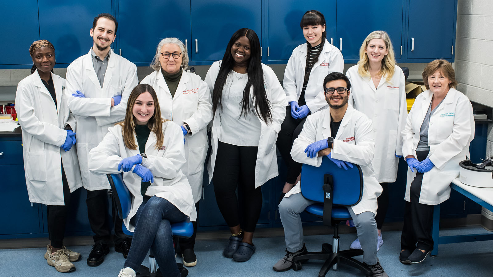 Biomedical sciences students smiling in PCOM's imaging laboratory