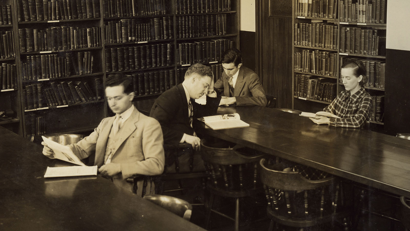 A few students studying in an old PCOM medical library
