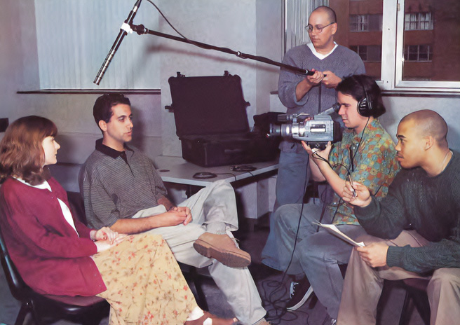 PCOM students film an interview as part of the documentary film. Subject Todd Morehouse (DO '99) and his wife Jennifer are interviewed by Francis Keating (DO '99). Mark Melden (DO '99) holds the microphone while Philadelphia filmmaker Jeff Wolfe films.