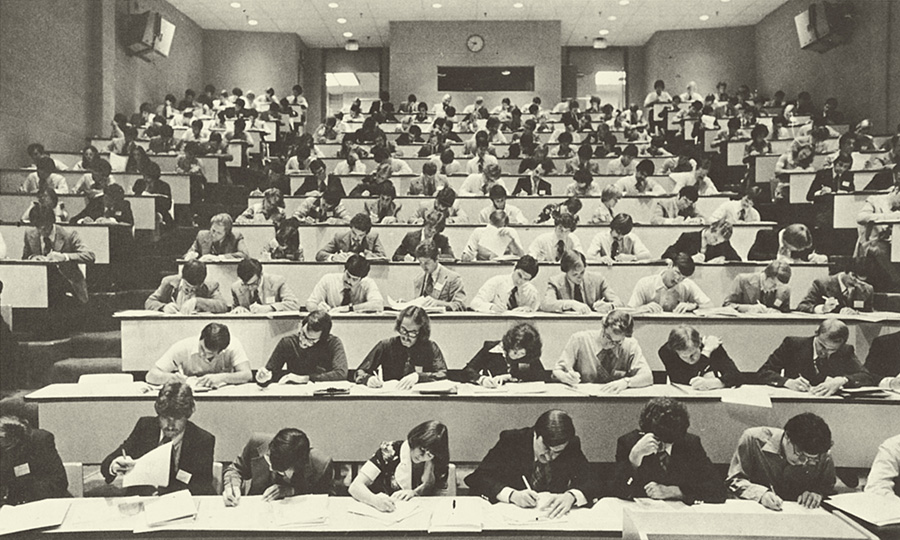 Medical students take an exam in one of PCOM's lecture hall amphitheaters, 1977.