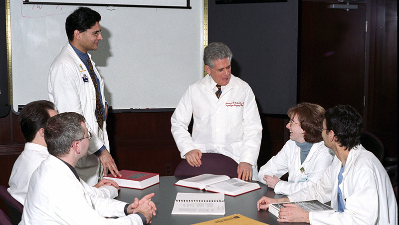 Leonard H. Finkelstein, DO '59 (center), served as the College's sixth president and CEO from 1990 to 2000. He then taught as a professor of urologic surgery until 2014. Photo circa 2007.