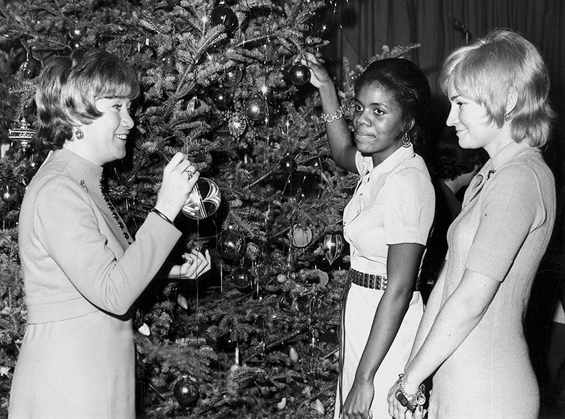Staff members Carol Fox, Nancy McCullen and Linda Ellis celebrate the holidays.