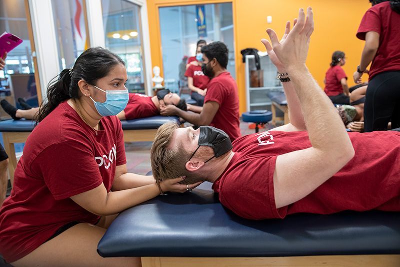 Medical students perform OMT techniques during an OMM laboratory in PCOM Georgia, 2021.