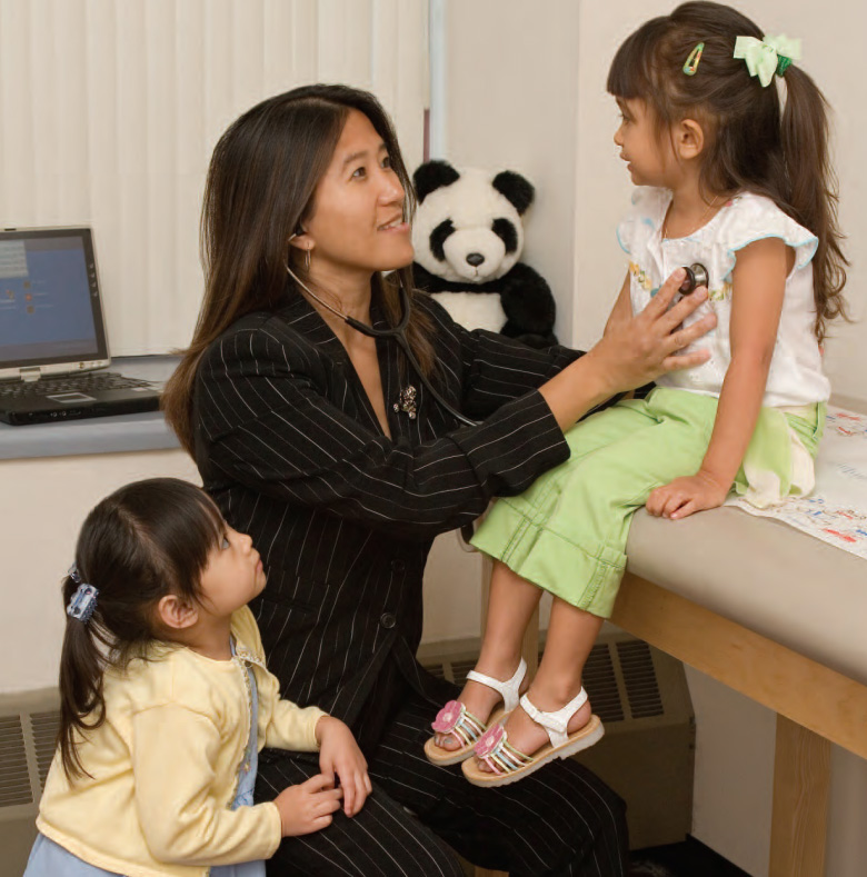 PCOM graduate and pediatric physician Larissa Fernando Dominy, DO '93, examines young patients in 2006. Dr. Dominy is now Director of Core Clinical Clerkship and Clinical Assistant Professor at PCOM.