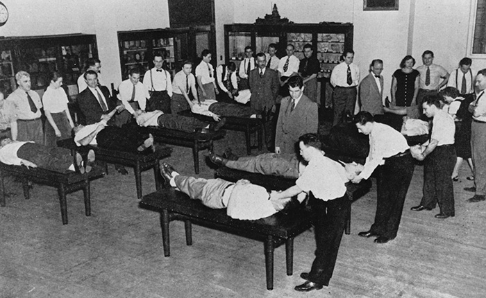 Students practice techniques during a 1947 osteopathic manipulative medicine class.