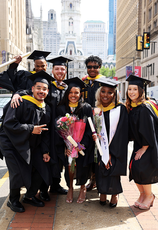Class of 2023 biomedical sciences graduates on Broad Street after their commencement ceremony.