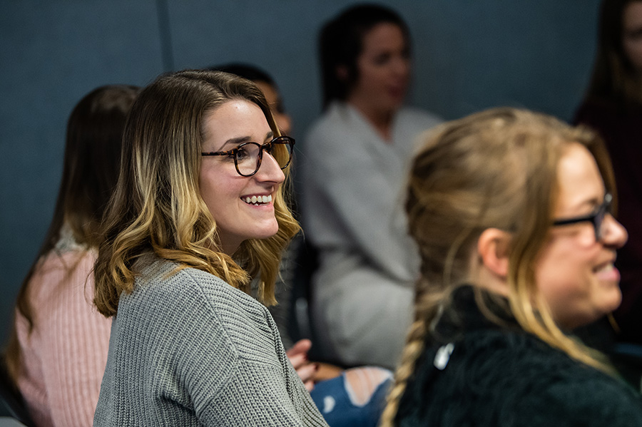 PCOM psychology students laugh during a class, 2019.