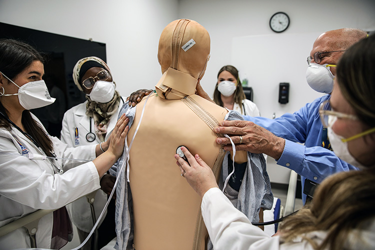 PCOM South Georgia professor George T. Fredrick, MD, instructions students in the Simulation Center, 2022.
