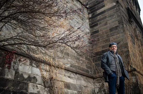 Dr. Gregory McDonald standing in front of a wall.