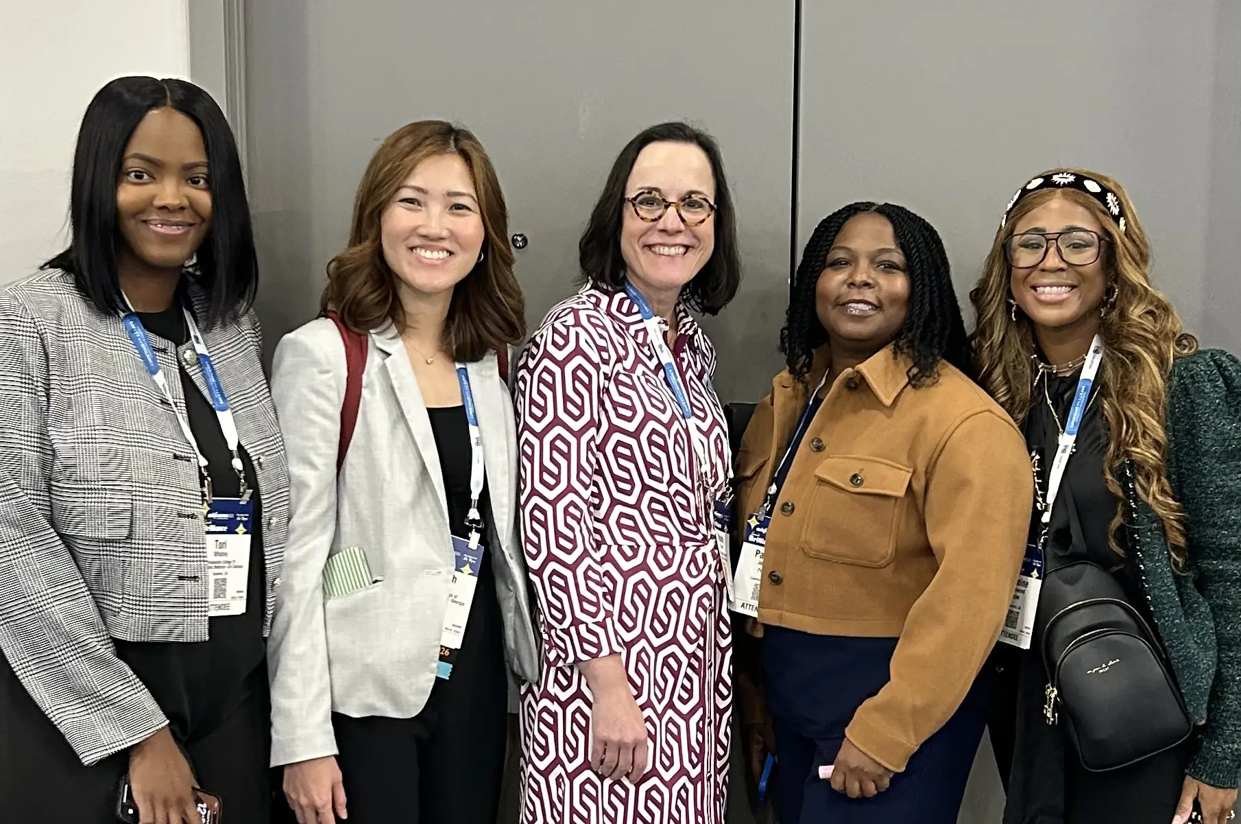 Dean Sara Reece is shown with four pharmacy students.
