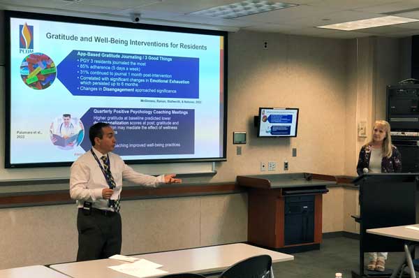 Dr. Scott Glassman and recent MAPP graduate Linda Martin are shown in a classroom.