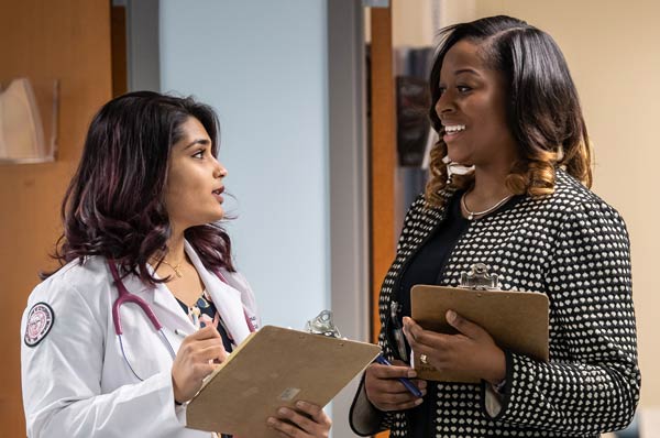 Clinical psychology student consults with professor