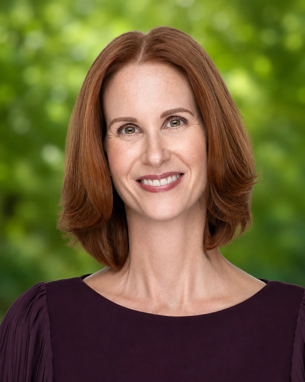 Professional headshot photograph of PCOM's Carrie Collins, JD, PhD, Chief Advancement Officer
