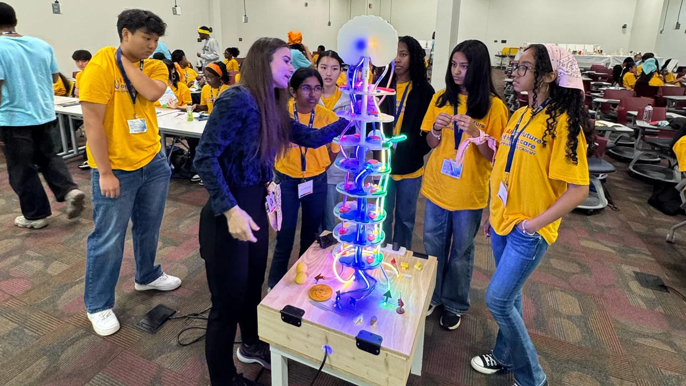 Opportunities Academy participants inspect science experiment