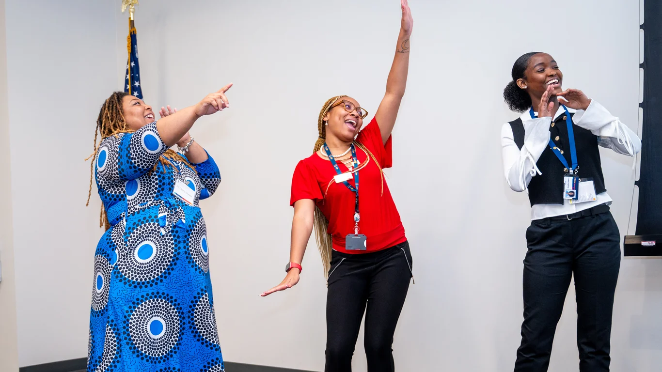 Opportunities Academy instructors lead a chant