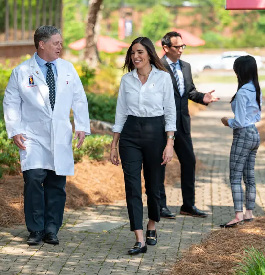 PCOM Georgia students and faculty walking and talking outside