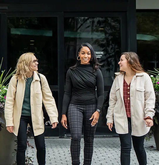 PCOM psychology students and faculty walking and talking on the Philadelphia campus