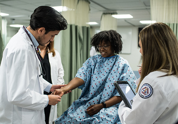 Standardized patient working with physician assistant students at PCOM