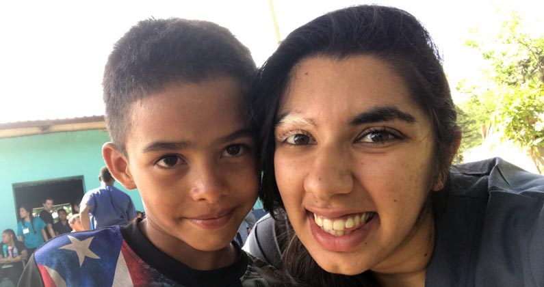 Akshita Taneja (MS/Biomed '19) smiles with a Honduran child during a medical mission trip.