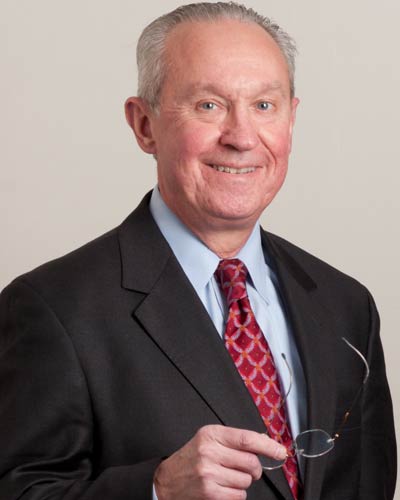 Professional headshot photograph of John Cavenagh, PhD, PA-C, DFAAPA