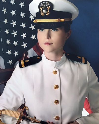 Professional military photograph of Marissa Manning, DO '20, wearing her U.S. Navy white dress uniform.