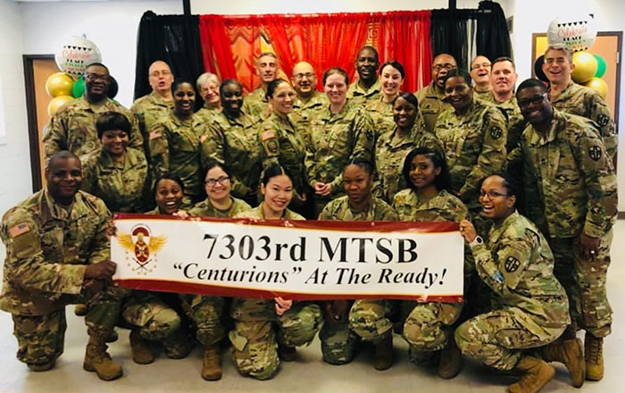 Group shot of Mai Quyen Dang and her US Army Reserve 7303rd MTSB