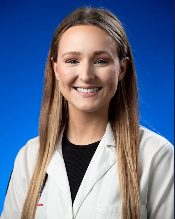 Professional headshot photo of PCOM Georgia grad Madison McGuire wearing her student pharmacist white coat