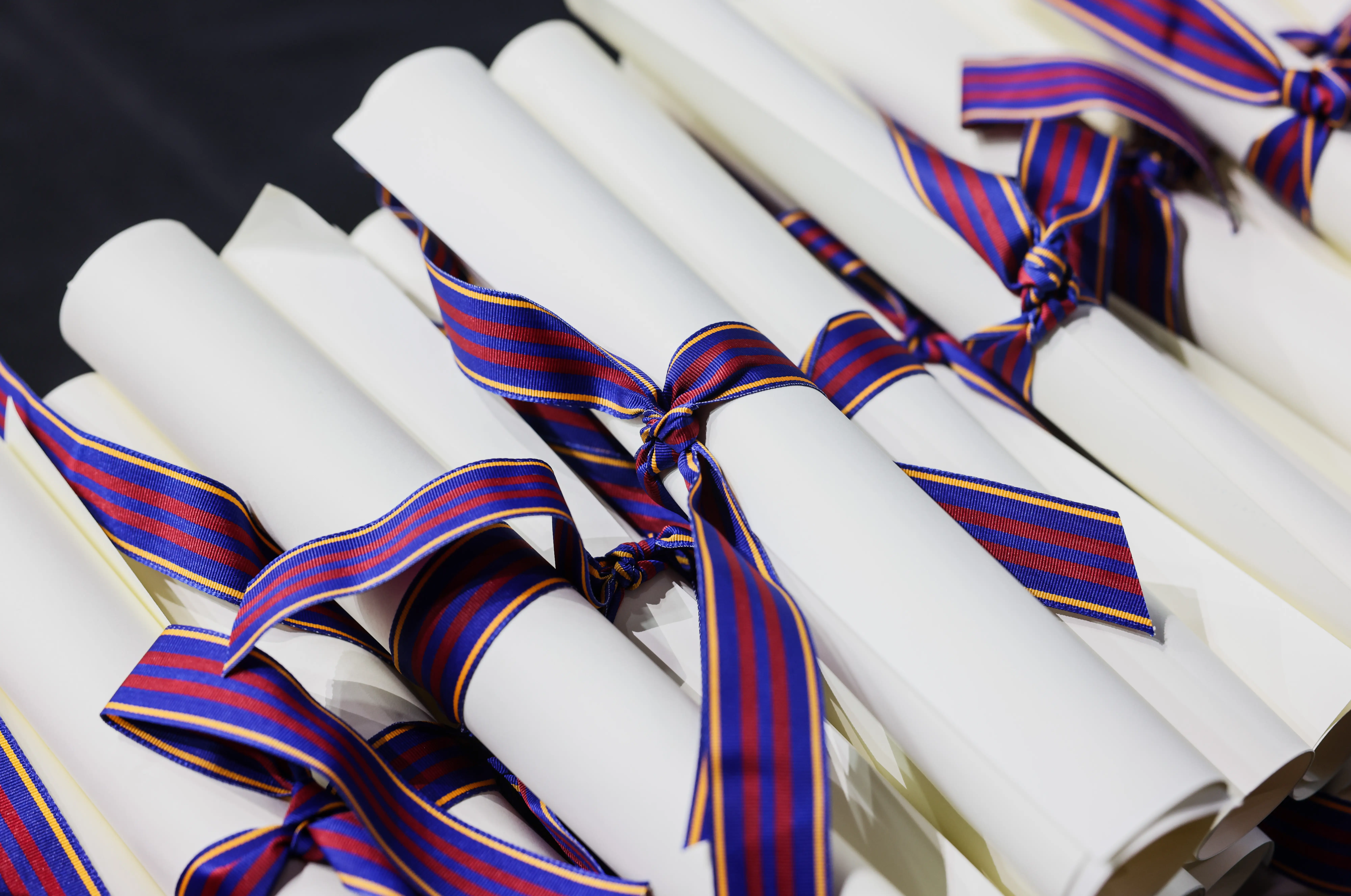 A stack of rolled diplomas
