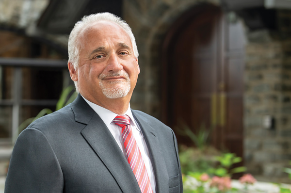 Newly elected PCOM Board of Trustees Chairman Thomas J. Gravina smiles outside the Philadelphia campus.