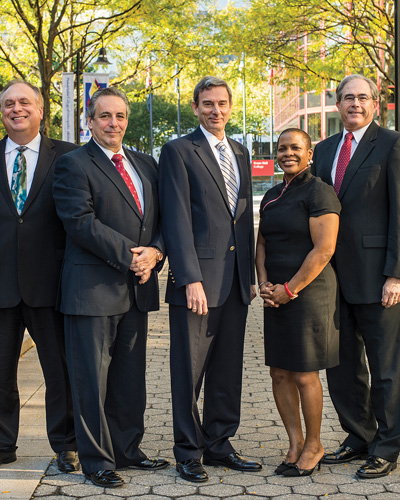 Dr. Schure poses with members of the PCOM Cabinet