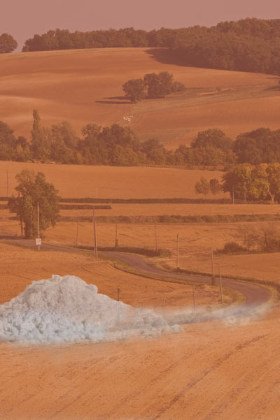 Mosaic image of opioid dust over a rural farmland landscape photo