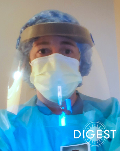 Michele Tartaglia, DO ’02, FACOOG, CS, wearing protective gear in a health clinic