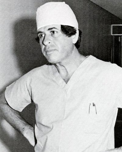Black and white photograph of Leonard H. Finkelstein, DO ’59 wearing surgeon scrubs.