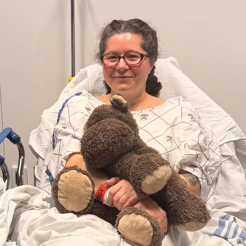 Hannah Callahan laying in a hospital bed