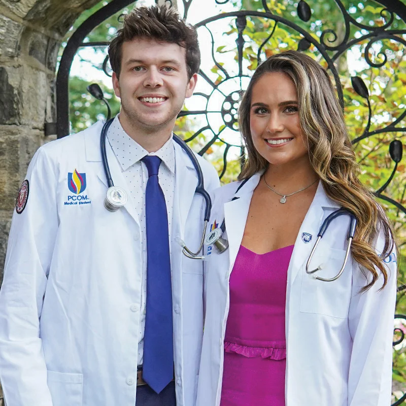 Dawson Nailor and Ellie Koerner in white lab coats