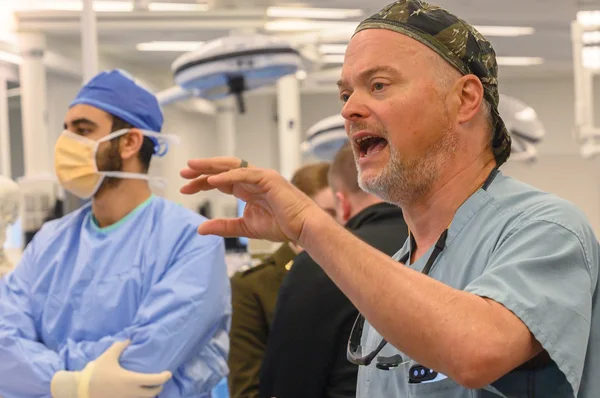 Between Trauma Bays and Battlefields