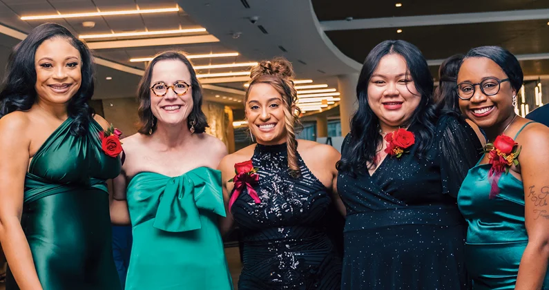Group of PCOM in evening dresses