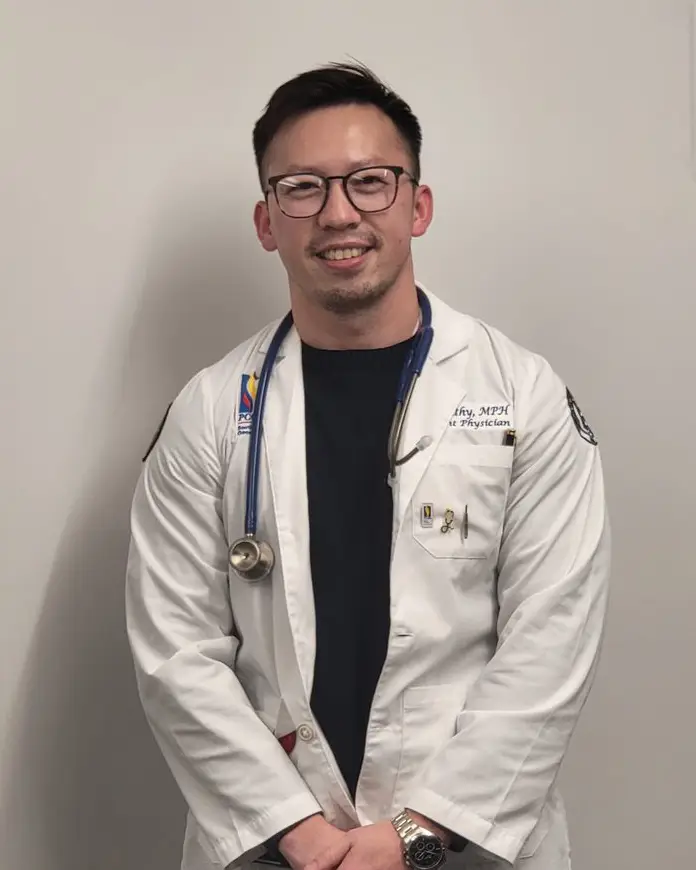 Pathya Kunthy (DO '26) wearing his physician white coat.