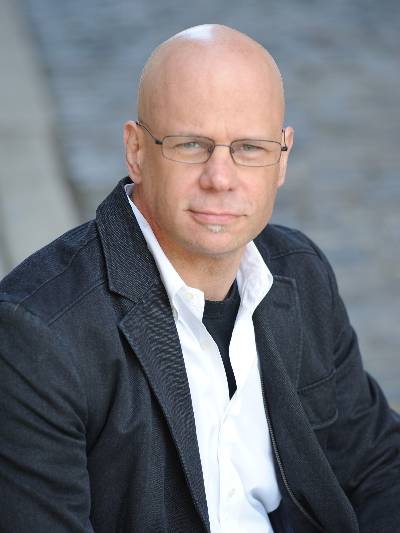 Professional headshot photograph of Gregory McDonald, DO '89