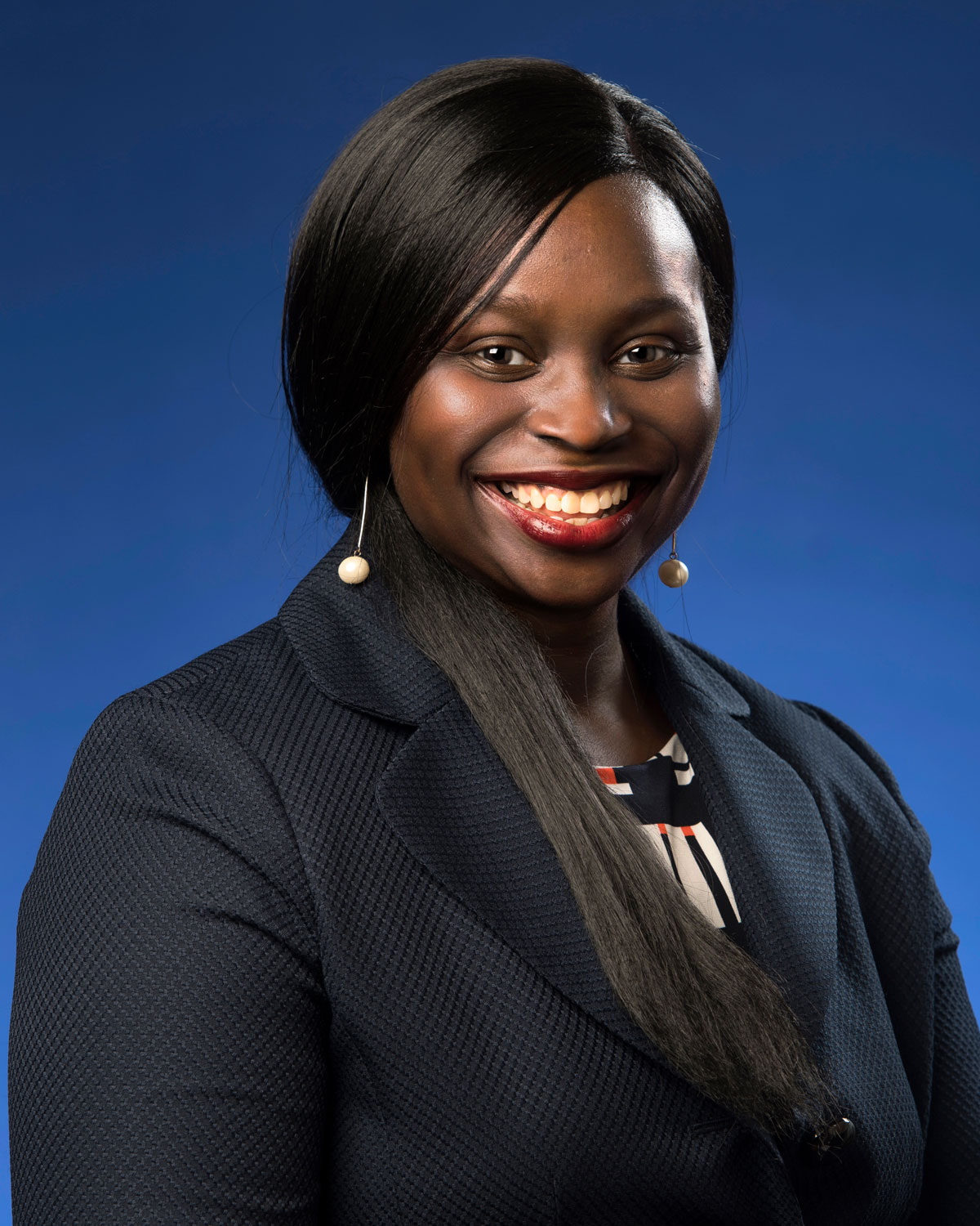 Professional headshot photograph of Edo-Abasi McGee, PharmD, BCPS.