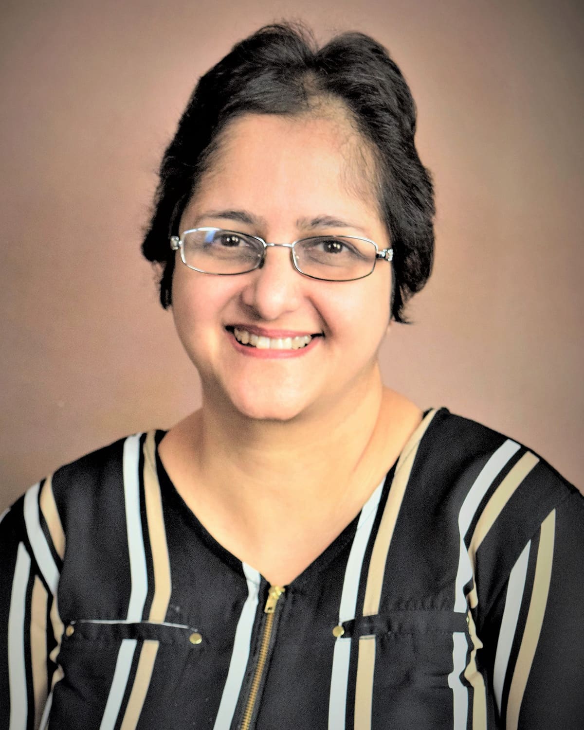 Professional headshot photograph of Savita Arya, MD Pathology, DPB, MBBS