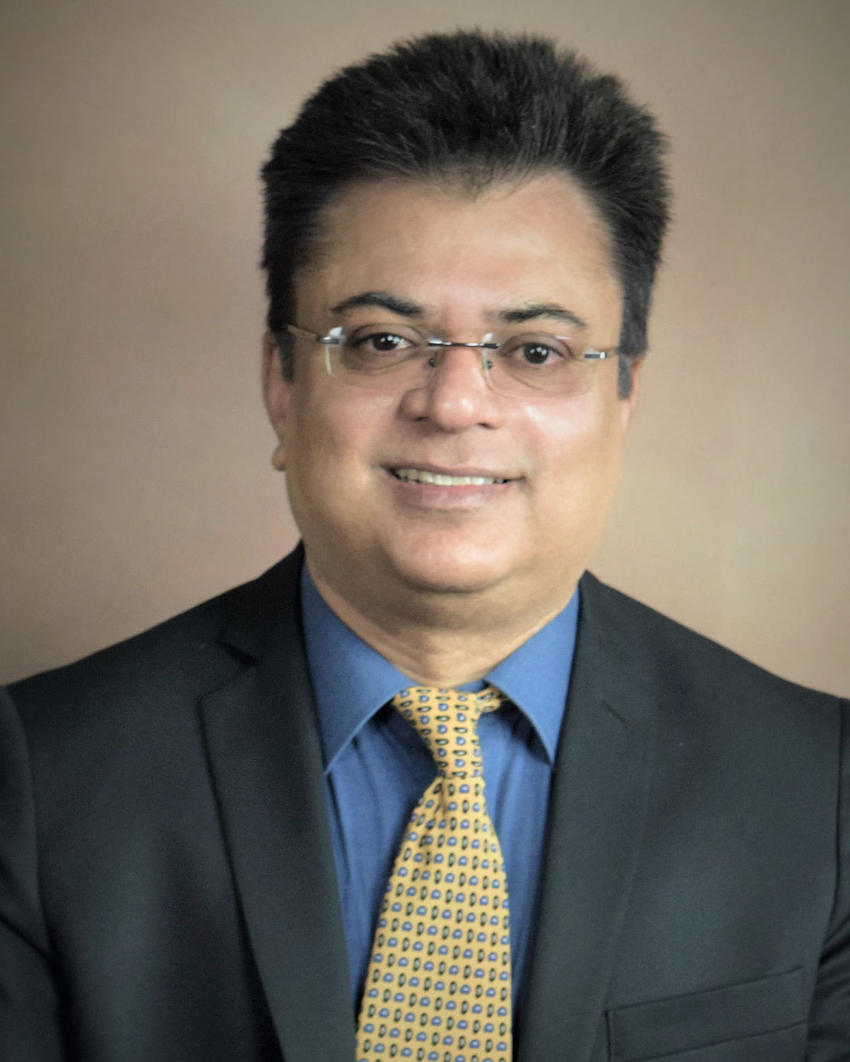 Professional headshot photograph of Shiv Dhiman, MD