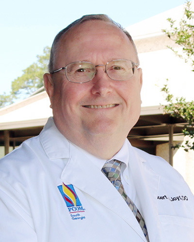 Headshot photo of Dr. Robert Lloyd wearing his physician white coat