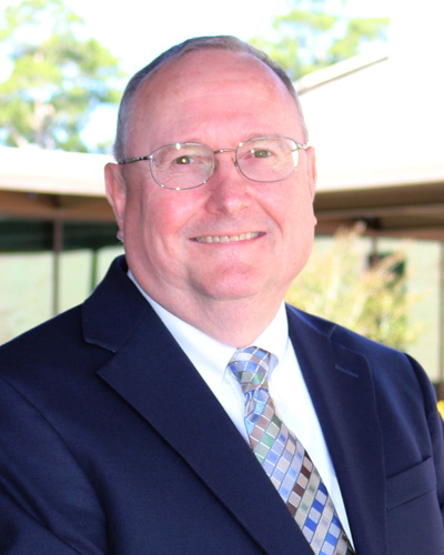 Professional headshot photo of interim dean Robert Lloyd, DO