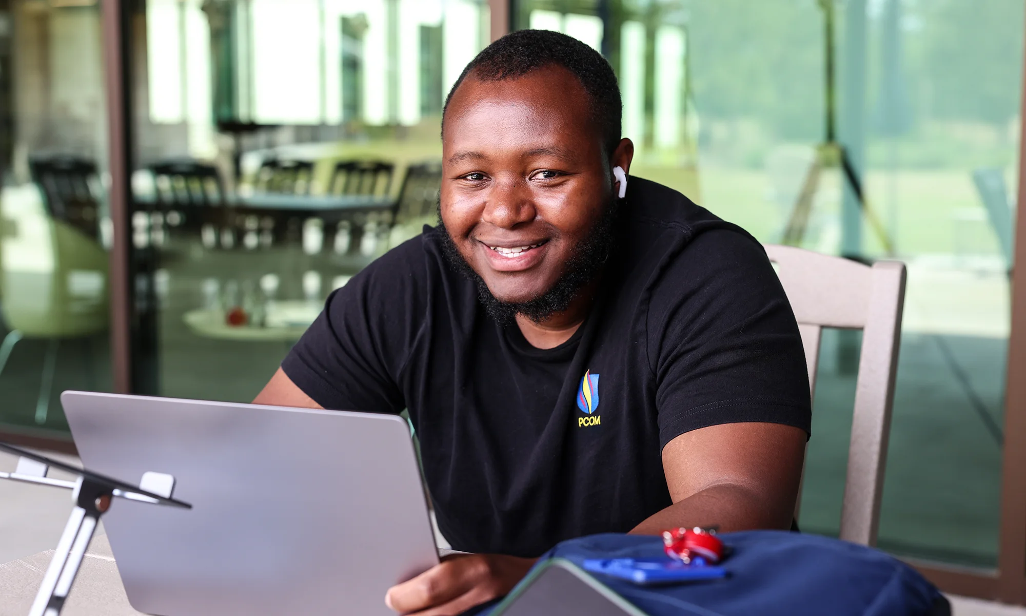 PCOM South Georgia graduate student completing an online program on a laptop