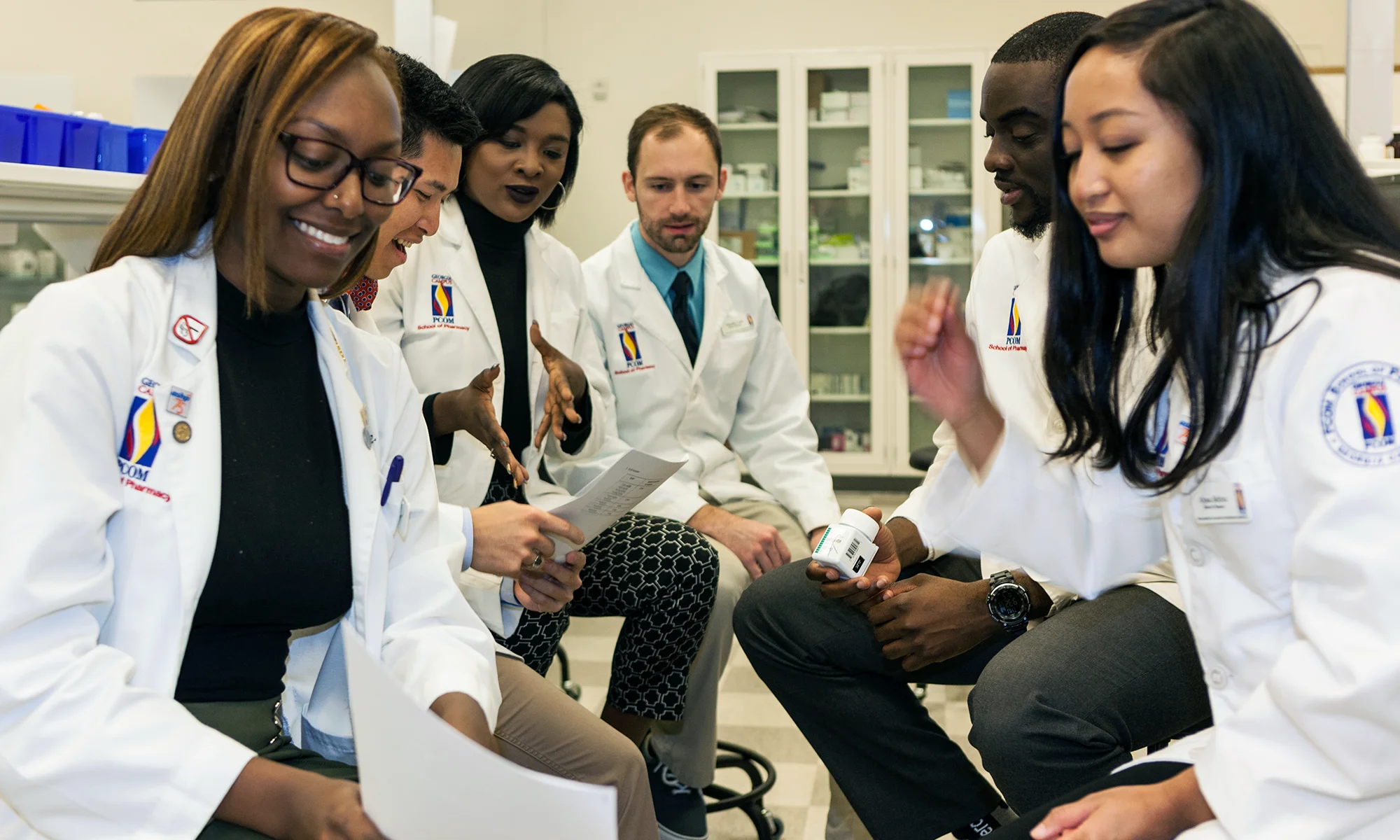 PharmD students work and collaborate during a lab exercise at the PCOM School of Pharmacy
