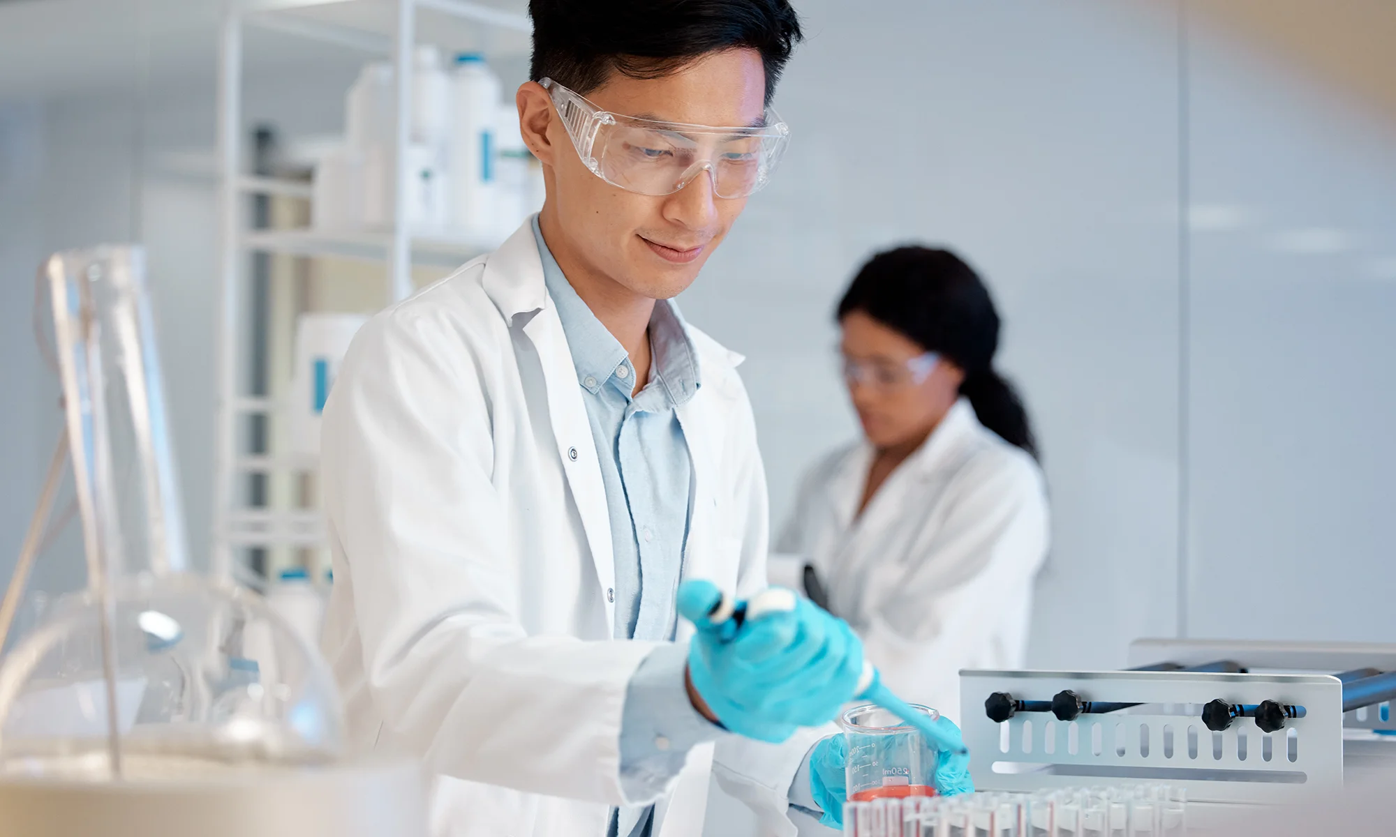 PCOM pharmaceutical researcher doing lab work on drug discovery and development