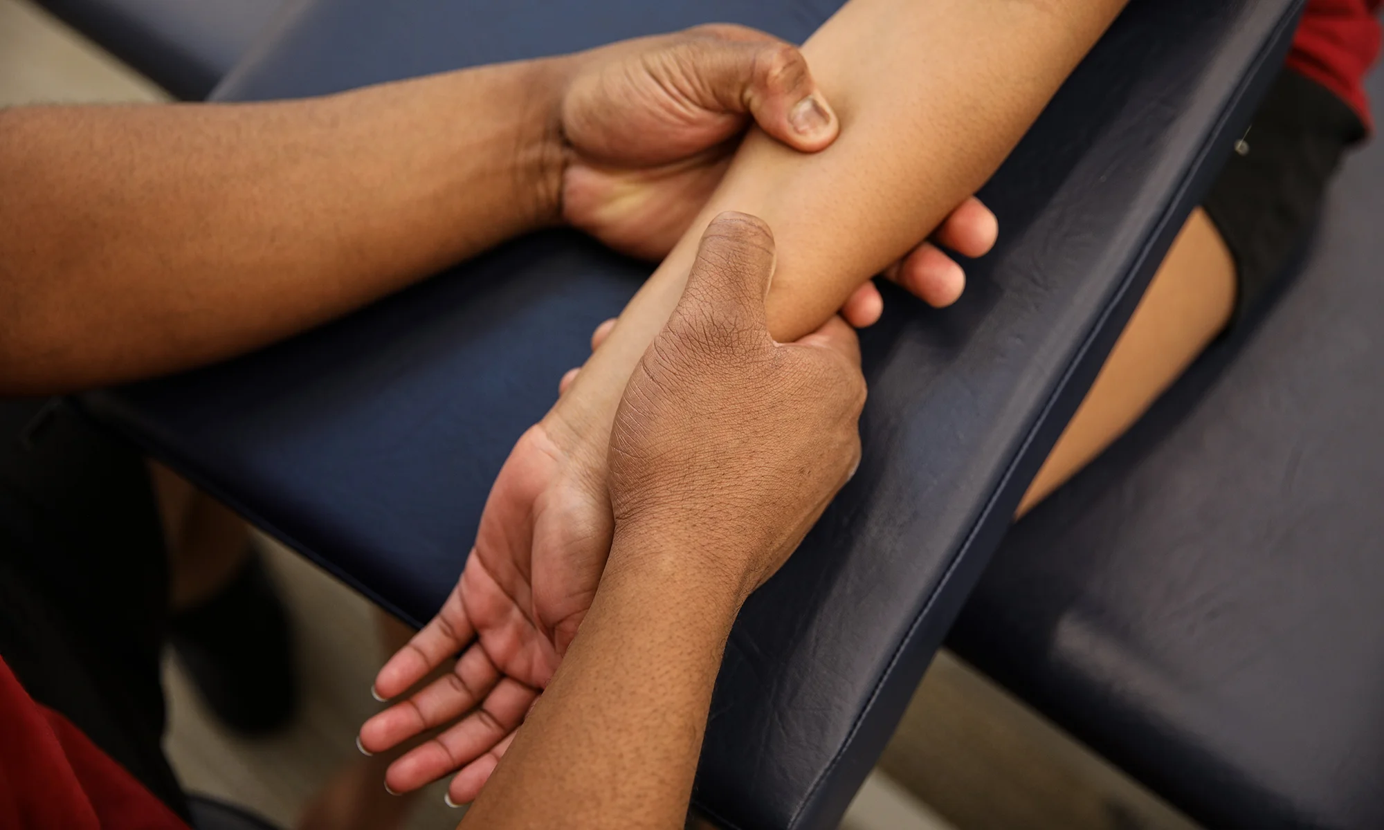 PCOM medical students practicing OMM wrist manipulation techniques